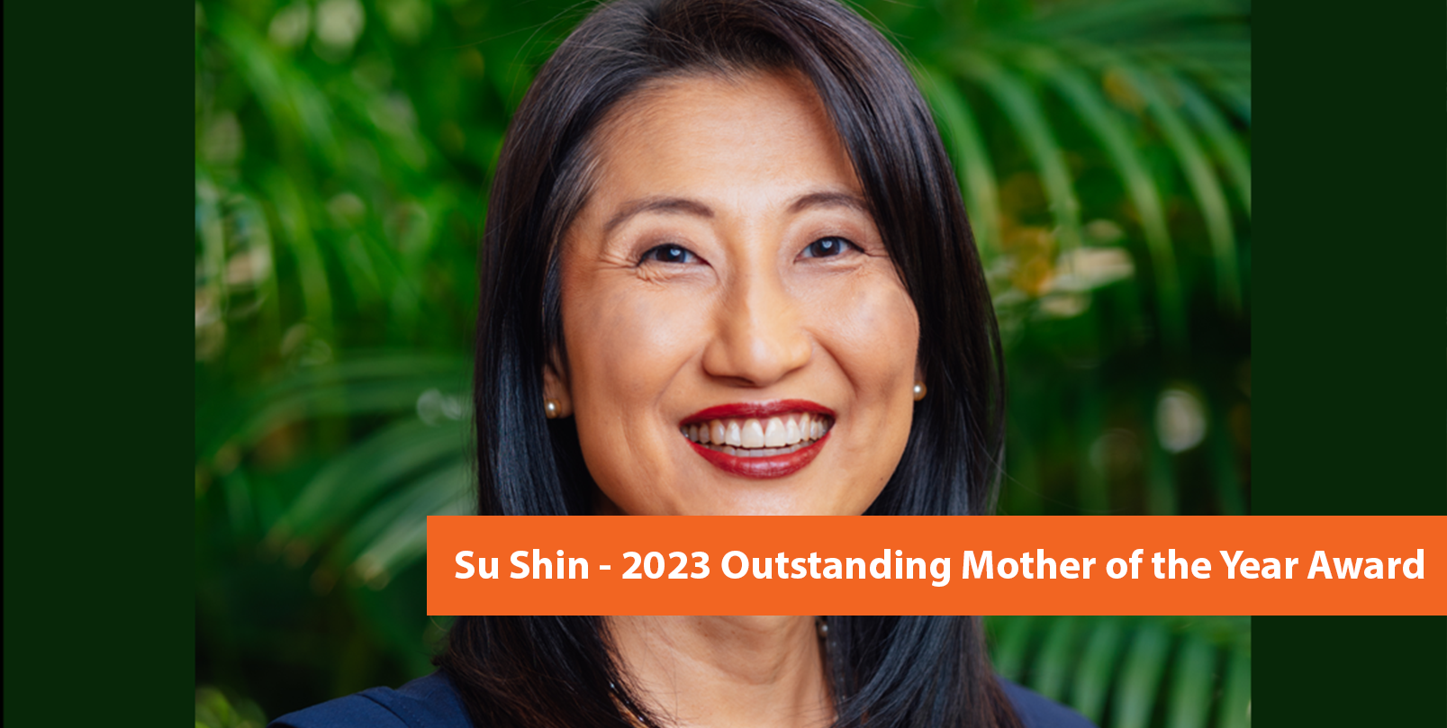 Su Shin pictured in front of green foliage.